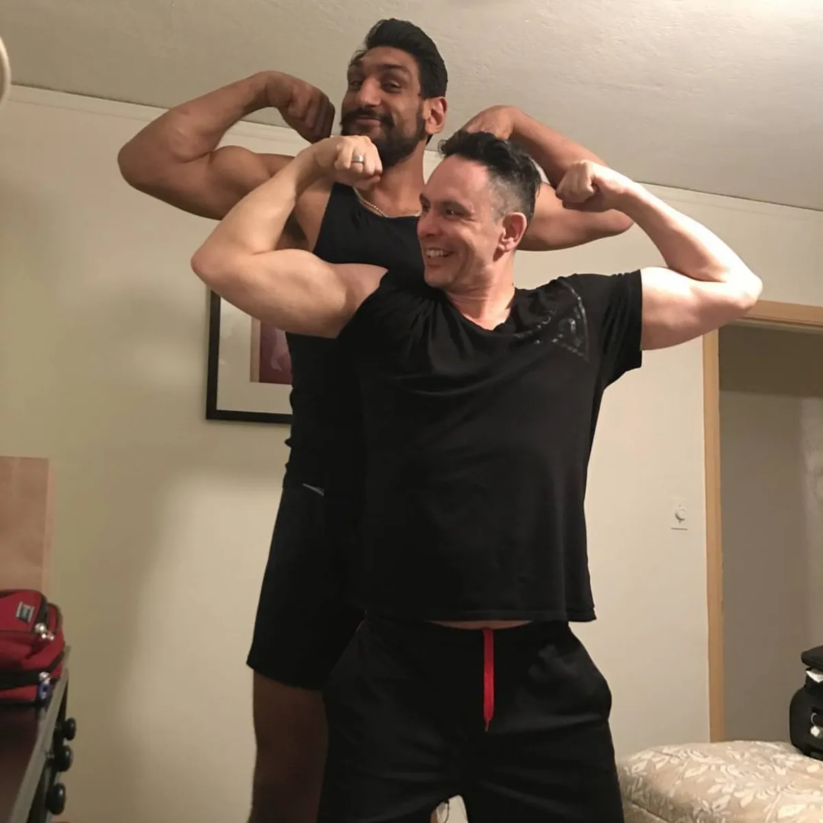 Shane James and Satnam Singh, the first Indian-born NBA draftee, flexing together off camera